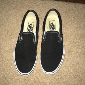 Black and white vans slip ons
